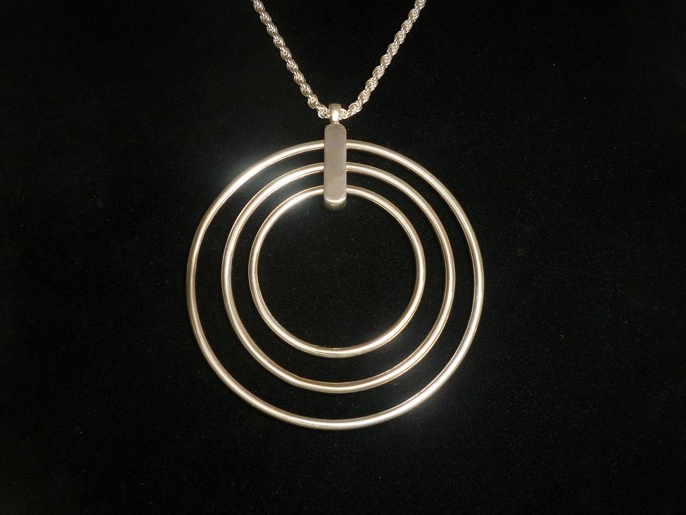 SOLID SILVER, THREE RING, REVOLVING NECKLACE, ON A 22 INCH SOLID ROPE CHAIN